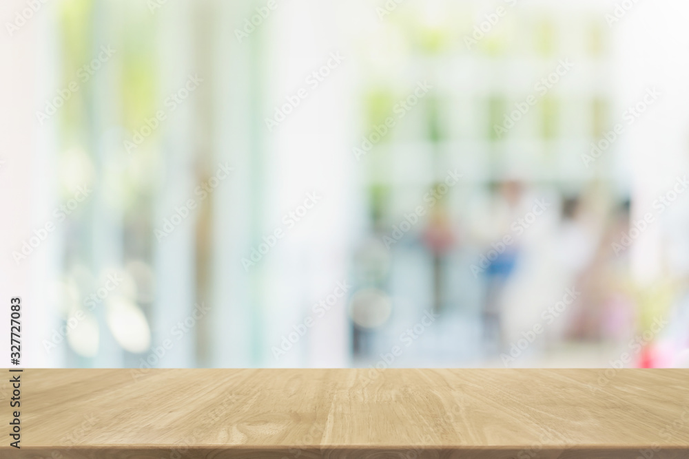 Empty wood table top and blurred of interior restaurant with window view green from tree garden background background - can used for display or montage your products. Empty wood table top and blurred of interior restaurant with window view green from tree garden background background - can used for display or montage your products.