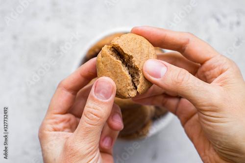 Break up, split crispy peanut butter cookies. Homemade vegan dessert. Vegan and vegetarian healthy food.