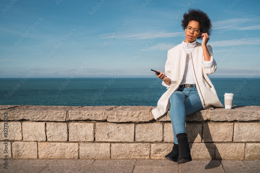 Latin woman using mobile phone. Latin woman using mobile phone.
