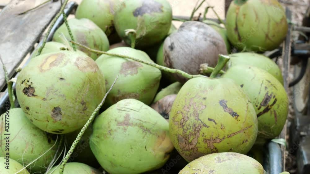 Group of coconut fruit in motorcycle truck , Transporting to sell , Agricultural product harvesting in Thailand Group of coconut fruit in motorcycle truck , Transporting to sell , Agricultural product harvesting in Thailand