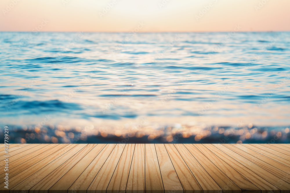 Summer ocean beautiful blurred background Palm leaves in the foreground And parquet plank flooring Abstract style backdrop