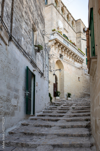 Cobblestone street in the Sassi di Matera a historic district in the city of Matera. Basilicata. Italy
