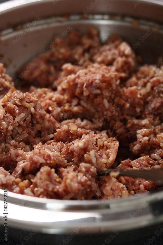 Making stuffing from minced meat and rice. Making Stuffed Peppers Series. Making stuffing from minced meat and rice. Making Stuffed Peppers Series.