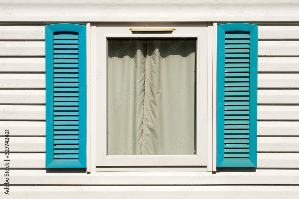 Window with wooden shutters