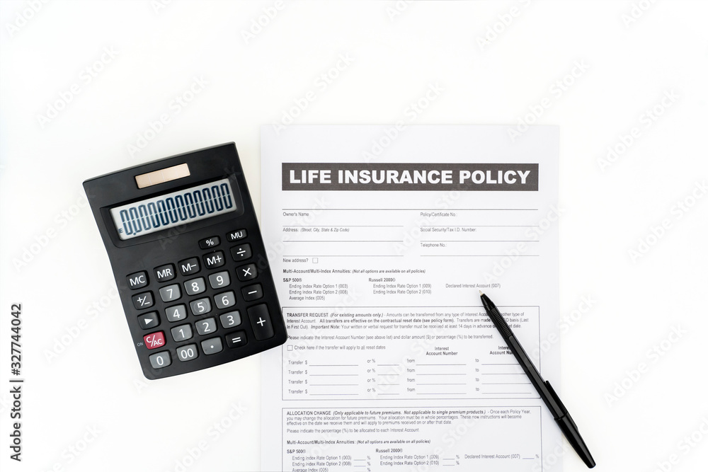 Top down of insurance document near a calculator Top down of insurance document near a calculator