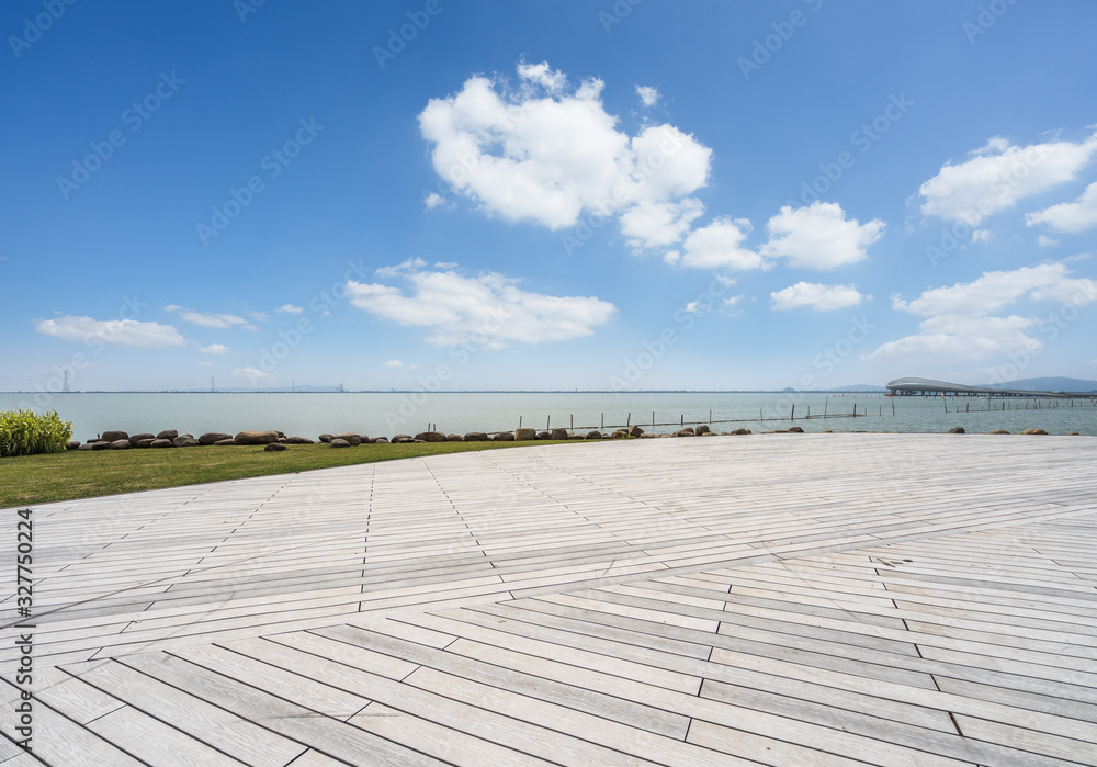 Outdoor viewing platform and lake landscape under the blue sky