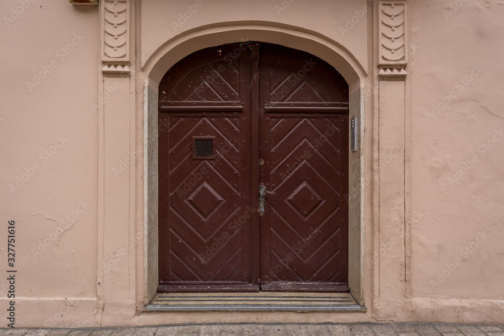 Wall background of old buildings with wooden door and windows