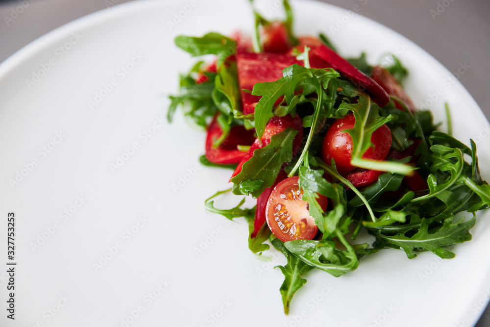 cherry tomato salad with arugula and pepper, healthy eating, copy-space for text cherry tomato salad with arugula and pepper, healthy eating, copy-space for text