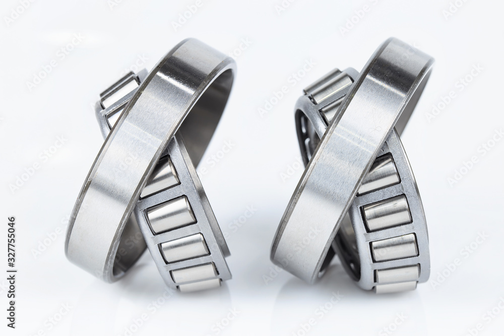 Close-up Tapered Roller Bearings spare part of mechanical on the white background.. Close-up Tapered Roller Bearings spare part of mechanical on the white background..