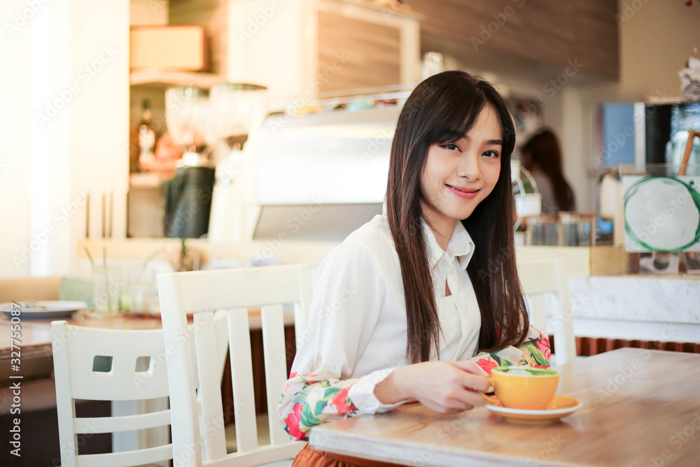 Beautiful asian woman eating delicious waffles in coffee shop cafe. Beautiful asian woman eating delicious waffles in coffee shop cafe.