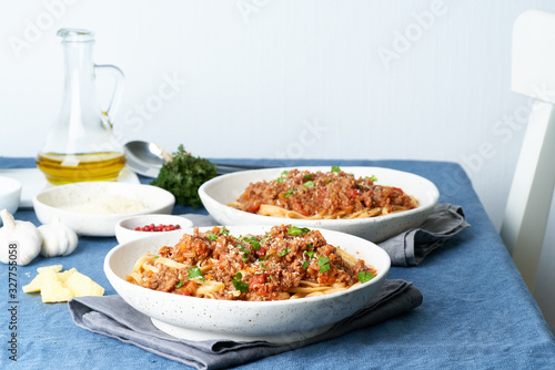 Pasta Bolognese Linguine with mincemeat and tomatoes. Italian dinner for two