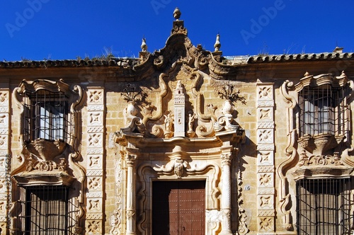 Copy of the Giralda tower above the doorway of the aristocratic palace, Cilla del Cabildo de la Catedral de Sevilla, Osuna, Spain. photo