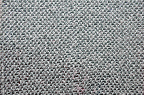 Fiber texture of woolen fabric. Grey. Background