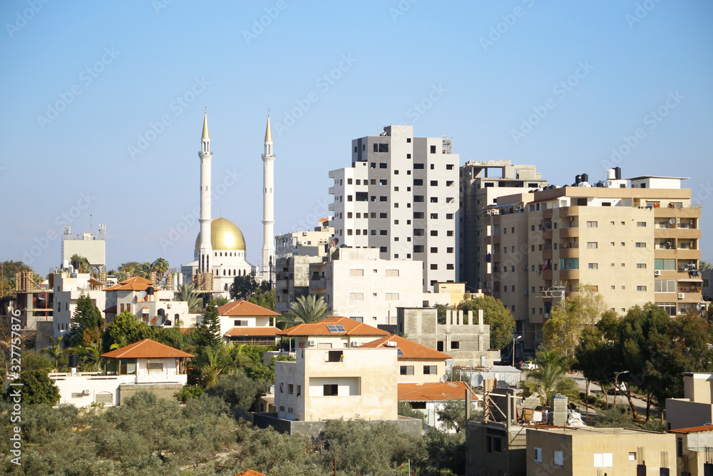 Qalqilya, West Bank . Many Arabic houses and buildings, overpopulation, Also shown is the Al-Fateh Mosque