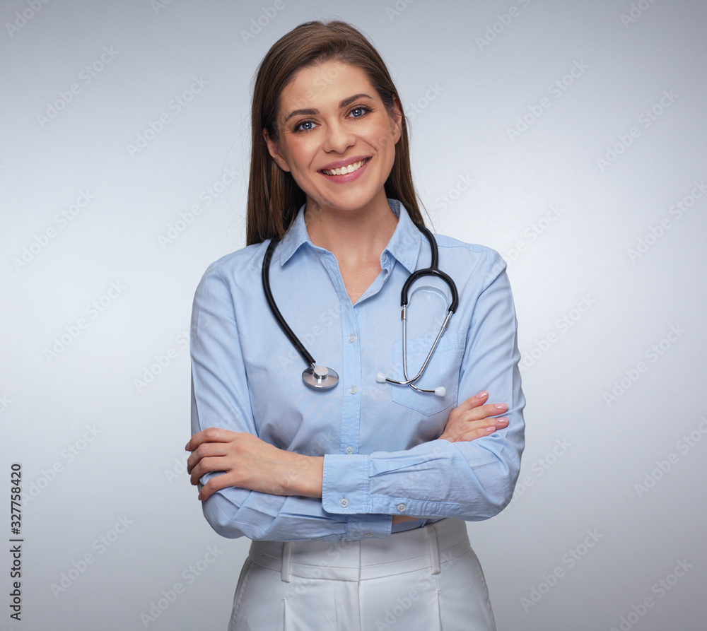 Smiling woman doctor in blue shirt with stethoscope. Smiling woman doctor in blue shirt with stethoscope.