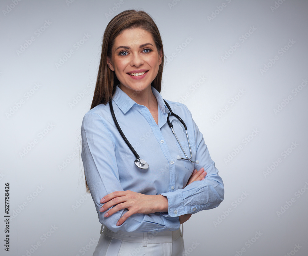 Portrait of smiling female medical worker with folded hands. Portrait of smiling female medical worker with folded hands.