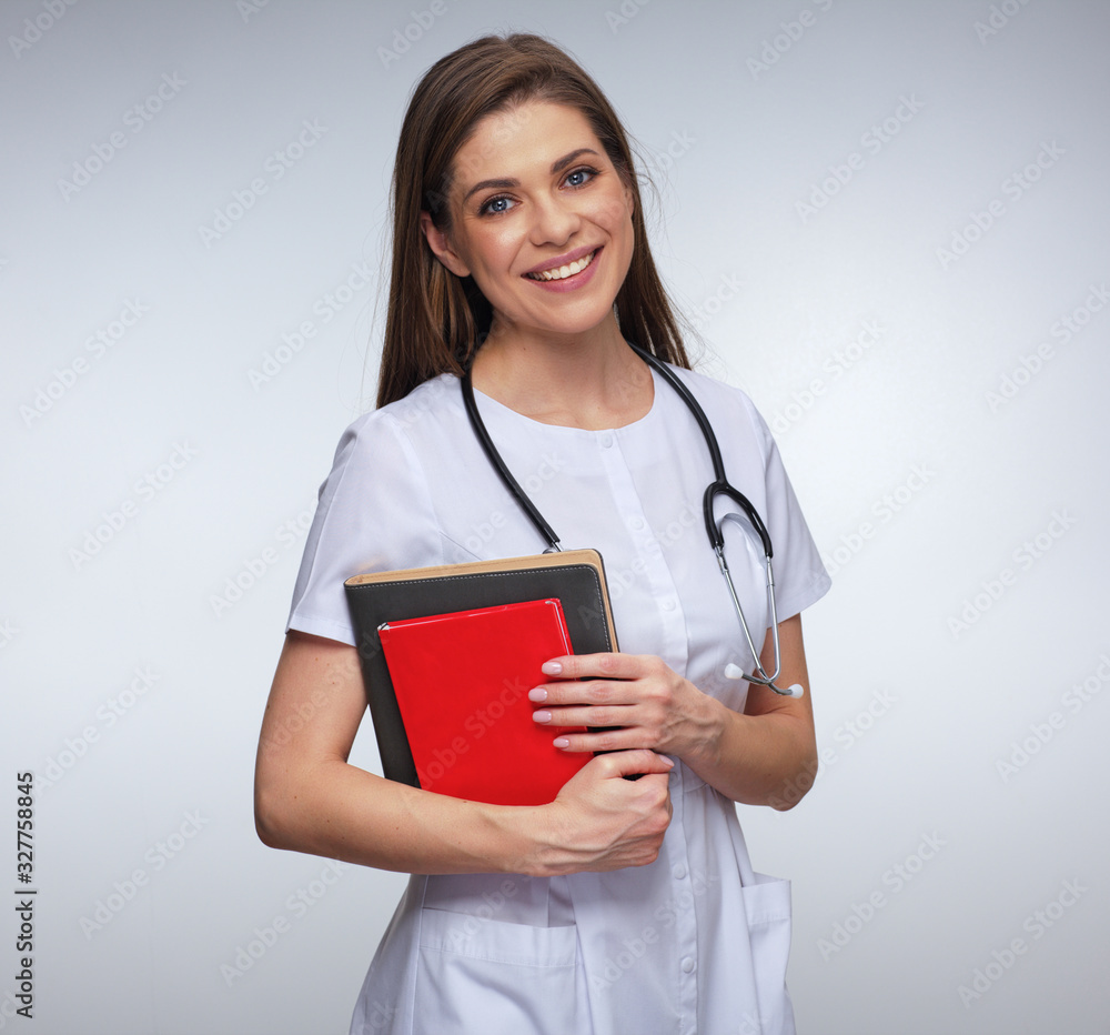 Woman medical student or doctor holding book Woman medical student or doctor holding book
