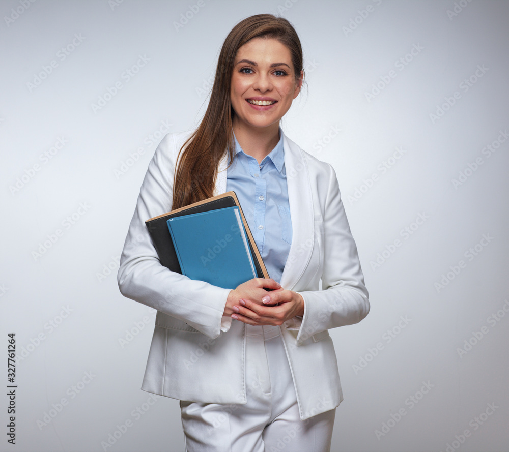 Smiling business teacher, woman holding book Smiling business teacher, woman holding book