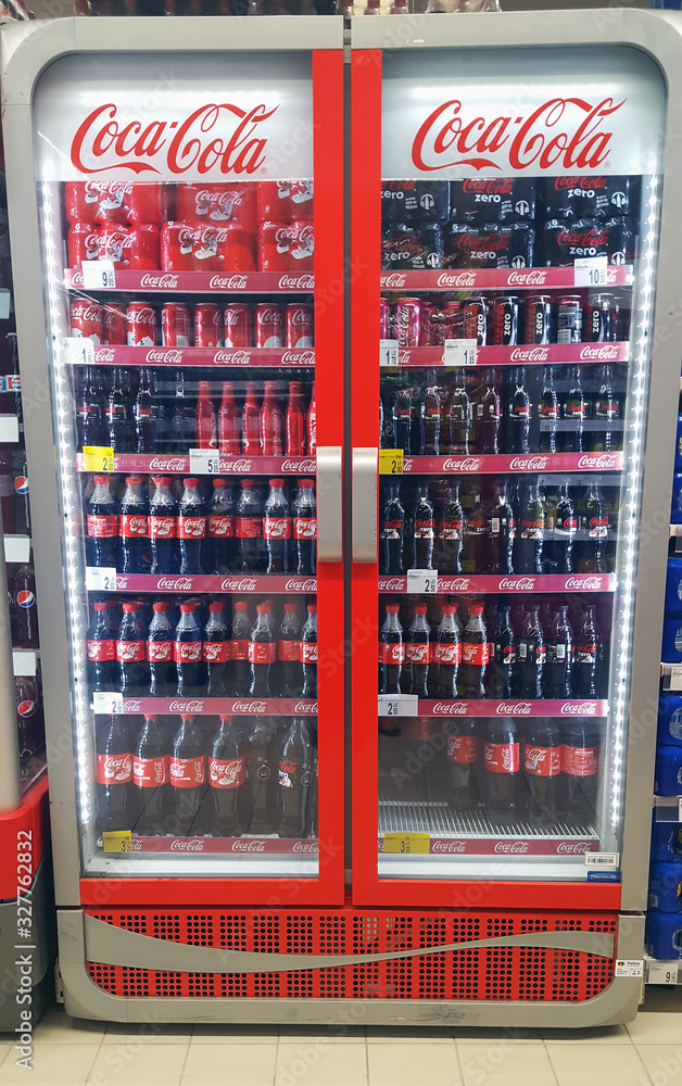 PIATRA NEAMT, ROMANIA - DECEMBER 12 2016: stack of Coca Cola bottles of  soda for sale in Carrefour supermarket store Stock Photo | Adobe Stock