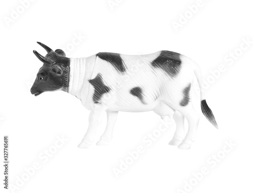 Plastic cow doll isolated on white background