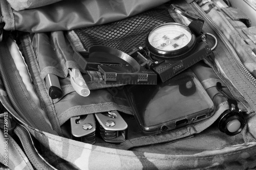 Compass and phone in a backpack