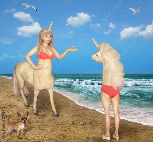 фотографія The female centaur meets the strange unicorn on the beach of the sea