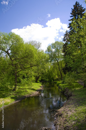 calm picturesque spring landscape with green trees in the park in   elazowa Wola in Poland