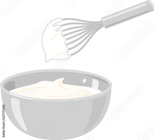 ボウルに入った生クリームと泡立て器