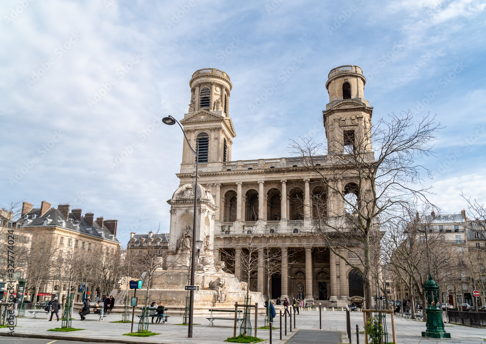 Church of Saint Sulpice with fountain in foreground in winter - Paris, France