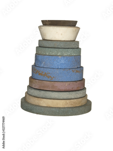 Stack of whetstones of various shapes and sizes isolated on a white background. photo