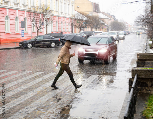 Wallpaper Mural Busy city street people on zebra crossing in a rainy day. Dangerous situation. Defocused image Torontodigital.ca