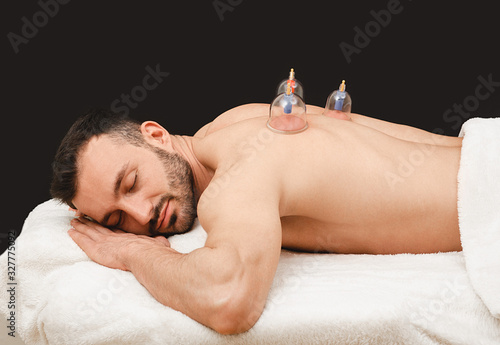 Fotografi Treatment of pneumonia in man using vacuum cups
