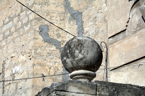 old stone ball on the wall architectural creation
