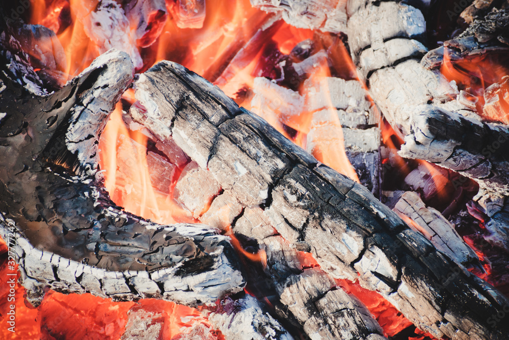 The burning charcoal. Hot fire close-up. Burning wood close-up. View of the fireplace inside. The burning charcoal. Hot fire close-up. Burning wood close-up. View of the fireplace inside.