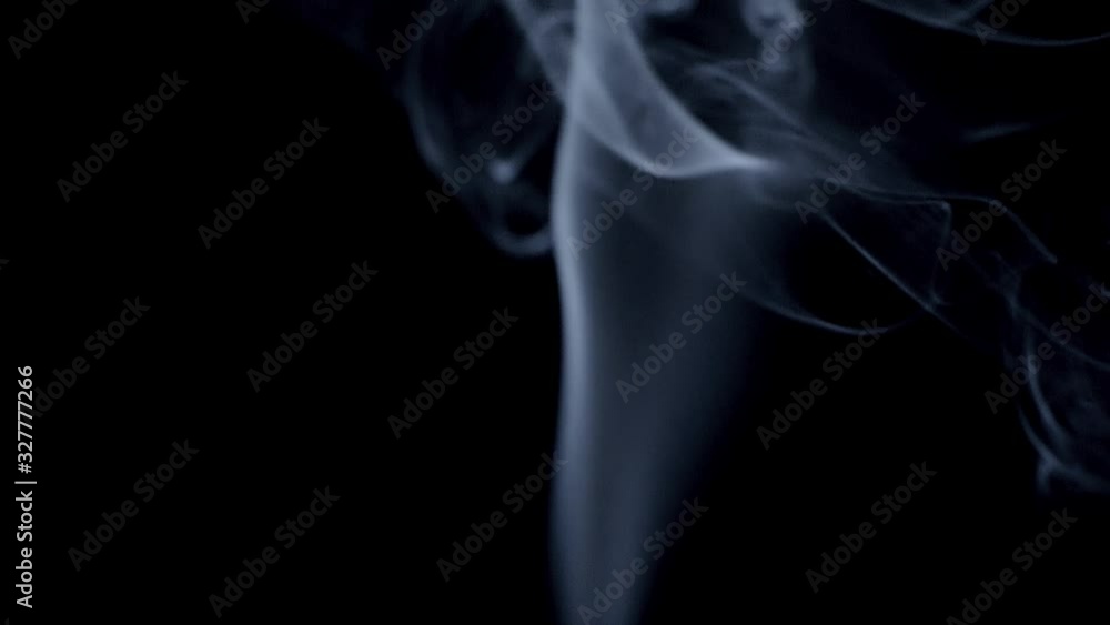 Real smoke on a black background. Thin Flexible Trickle of Real Smoke. Colorful real smoke rises up. Ideal for background or over-layer with blending mode add, screen, lighten. Defocused. Real smoke on a black background. Thin Flexible Trickle of Real Smoke. Colorful real smoke rises up. Ideal for background or over-layer with blending mode add, screen, lighten. Defocused.