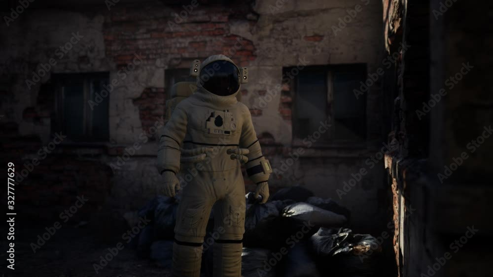 Lost Astronaut near Abandoned Industrial Buildings of Old Factory Lost Astronaut near Abandoned Industrial Buildings of Old Factory