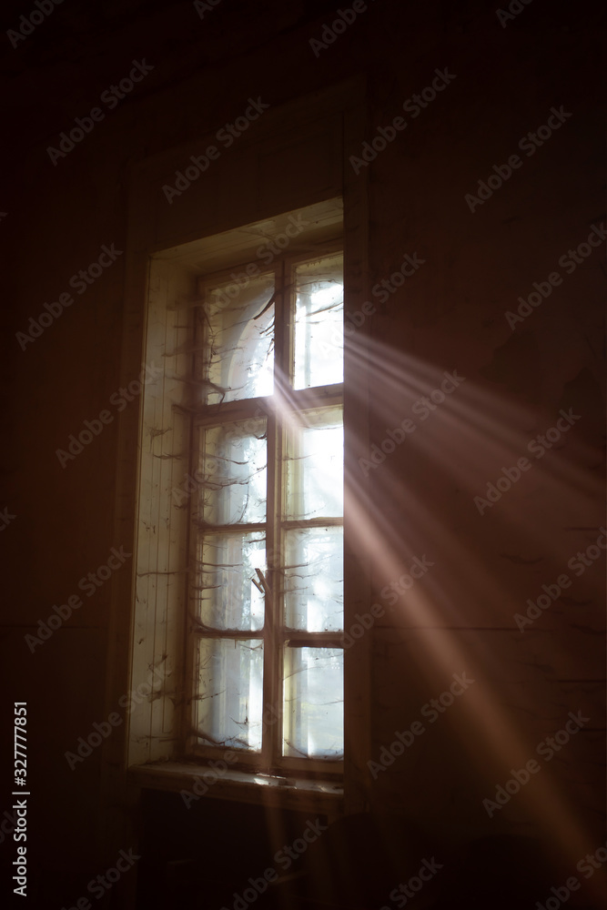 Old dirty window with web and sun rays. Old dirty window with web and sun rays.