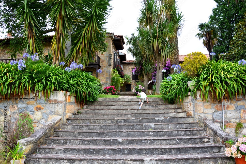 Obraz premium a boy climbing the stairs in a park