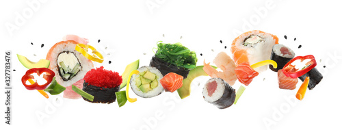 Fototapeta Naklejka Na Ścianę i Meble -  Different sushi rolls and ingredients on white background