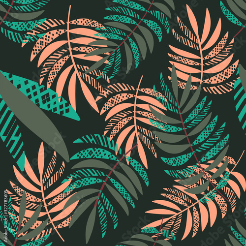 Vector seamless tropical pattern with palm leaves  on dark green background. ...