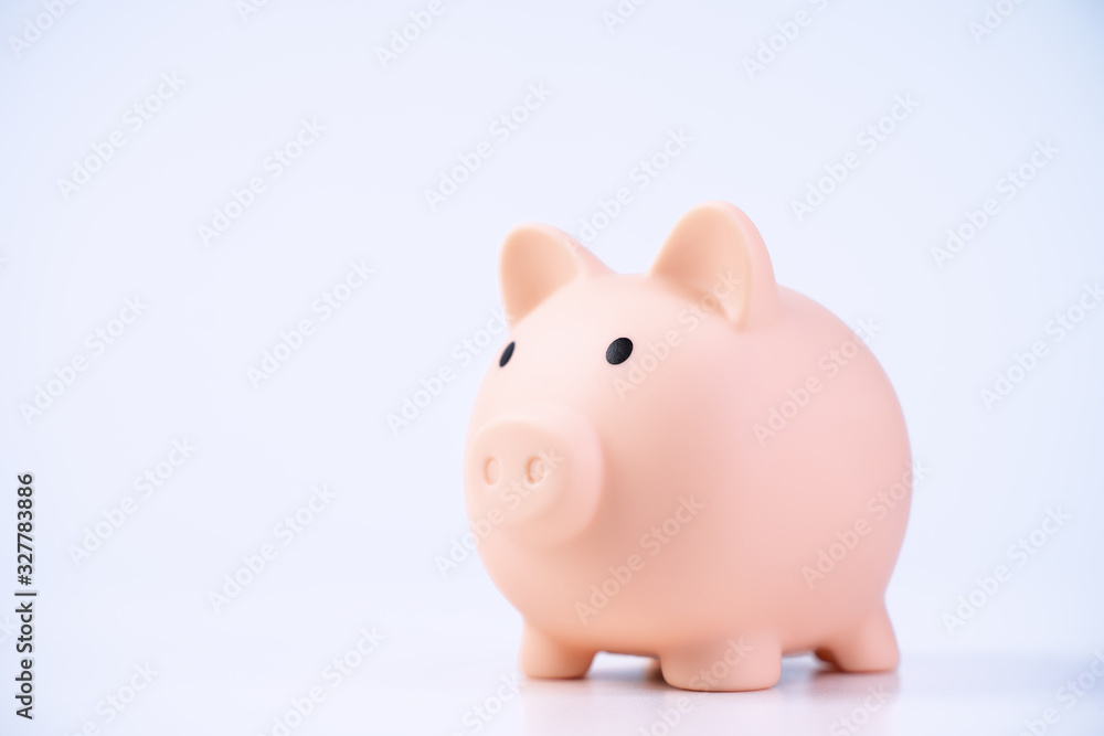 Financial concpet - Piggy bank, beautiful red white wooden house model on white background, saving money to buy insurance, close up, copy space. Financial concpet - Piggy bank, beautiful red white wooden house model on white background, saving money to buy insurance, close up, copy space.