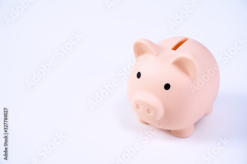 Schilderij op canvas Financial concpet - Piggy bank, beautiful red white wooden house model on white background, saving money to buy insurance, close up, copy space