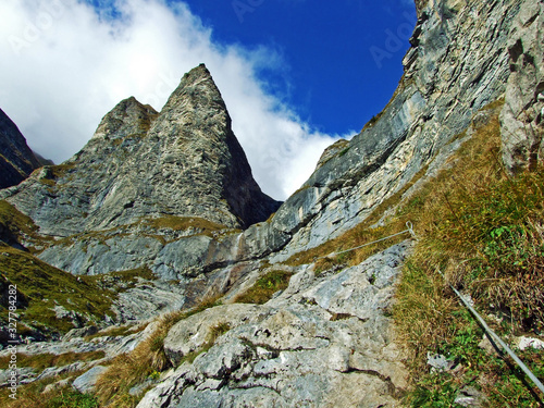 Steep picturesque rocks Falknistürm (Falknisturm or Falknistuerm) in the Ratikon border mountain massif or Rätikon Grenzmassiv, Mainfeld - Canton of Grisons (Graubünden or Graubuenden), Switzerland photo