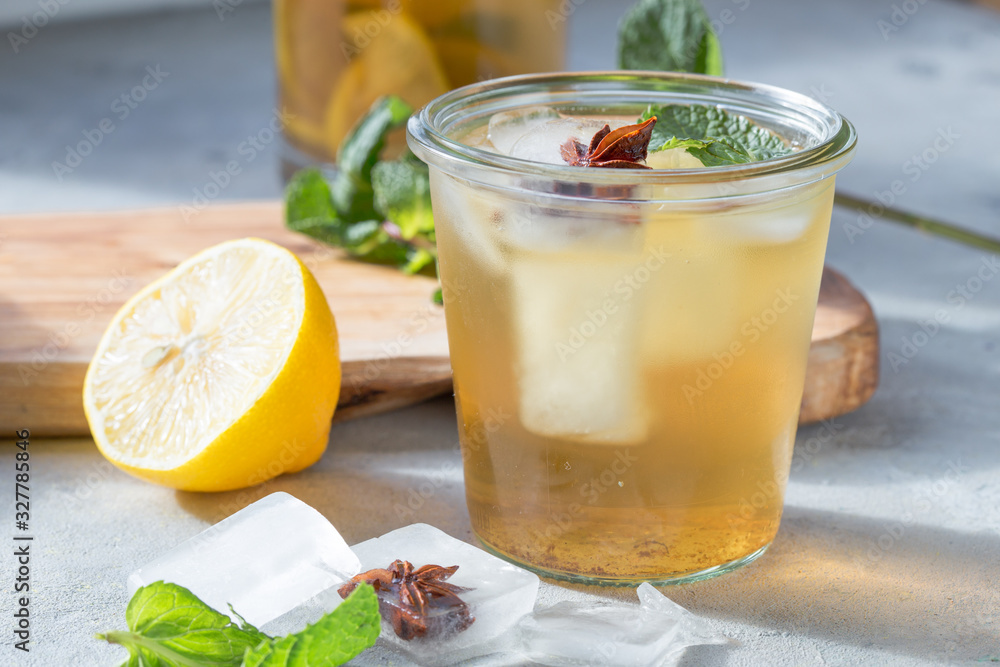 Kombucha or cider fermented drink in glass with anise ice. Heathy probiotic drink Kombucha or cider fermented drink in glass with anise ice. Heathy probiotic drink