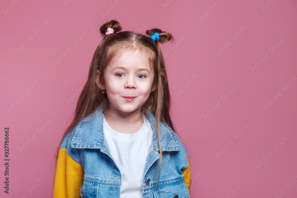 funny little kid girl in denim jacket isolated on pink funny little kid girl in denim jacket isolated on pink