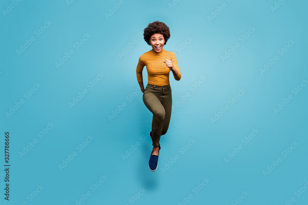 Full length body size view of her she nice lovely sporty cheerful active strong wavy-haired girl running purpose isolated on bright vivid shine vibrant blue green teal turquoise color background Full length body size view of her she nice lovely sporty cheerful active strong wavy-haired girl running purpose isolated on bright vivid shine vibrant blue green teal turquoise color background