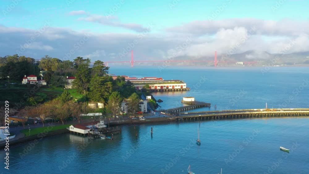 Aerial view of Golden Gate Bridge in San Francisco during beautiful sunset with mist. USA, California Aerial view of Golden Gate Bridge in San Francisco during beautiful sunset with mist. USA, California