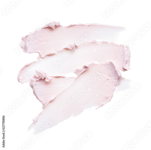 фотографія Gently pink brush strokes and texture of face cream or pink acrylic paint on a w
