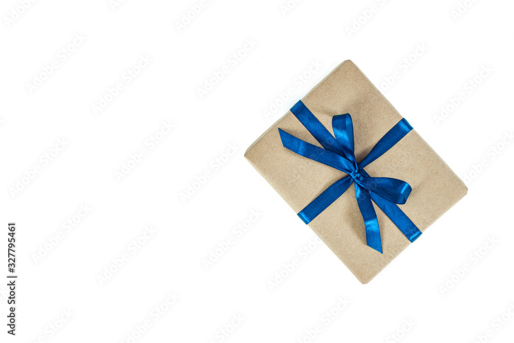 Present box package in craft paper over white background. Top view, flat lay Present box package in craft paper over white background. Top view, flat lay