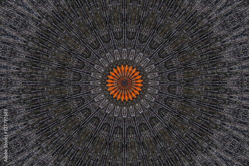 Abstract black pattern design background with orange flower graphic in the middle.